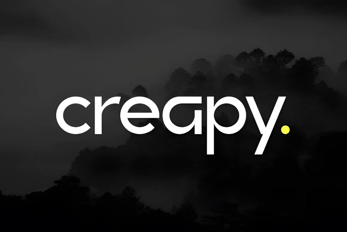 Best Sans Serif Fonts: 40 Modern Typefaces for Right Now 14 The Creapy font displayed in a modern style against a misty forest background.