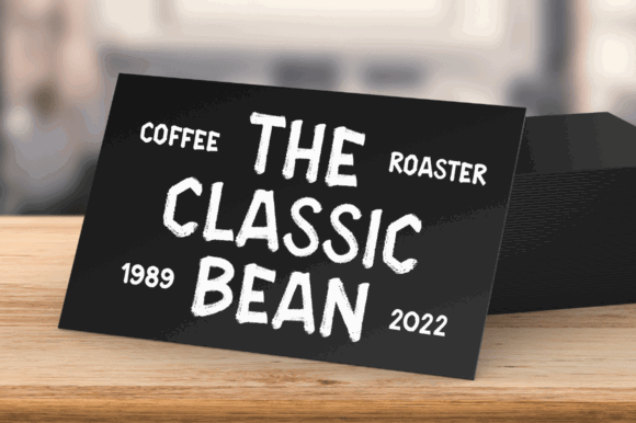 70+ Food Logo Fonts for Restaurants, Cafes, and Food Brands 110 Chalkboard sign displaying 'The Classic Bean' coffee roaster logo with a rustic design.