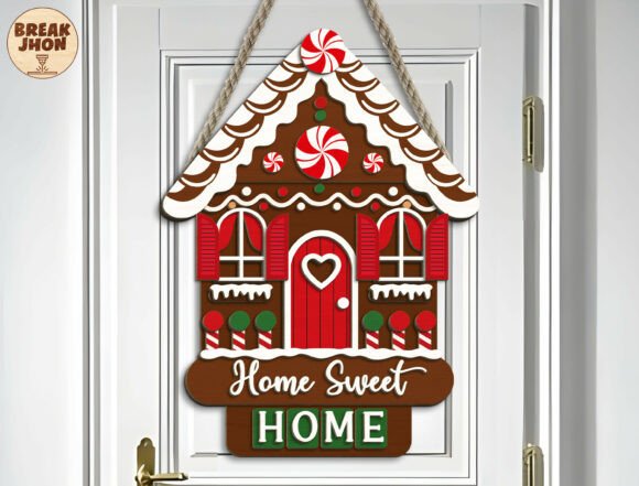 99+ Laser Cut Wood Projects To Sell From Home 190 Colorful wooden door sign shaped like a gingerbread house with 'Home Sweet Home' text.