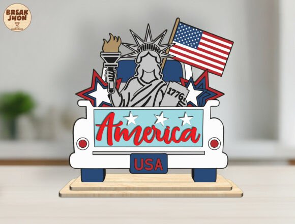99+ Laser Cut Wood Projects To Sell From Home 167 Laser cut wood ornament featuring the Statue of Liberty, American flag, and the word America on a truck design