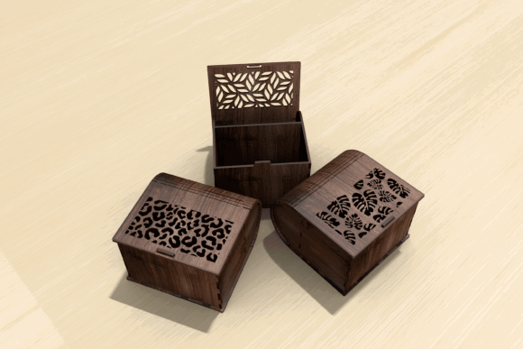 99+ Laser Cut Wood Projects To Sell From Home 475 Three laser cut wood boxes with intricate designs on the lids, showcasing unique patterns.