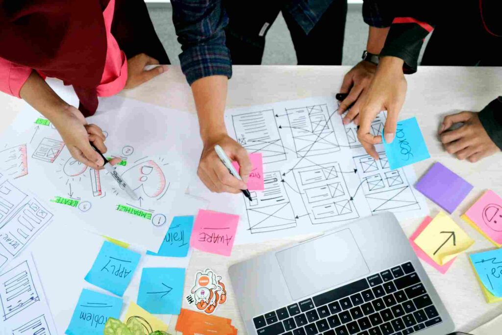 Why Clients Sometimes Choose AI Designs Over Better Custom Work 6 designer explaining AI designs and custom design strategy to a client