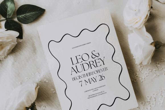 17 Wedding Invitation Template Ideas You Can Customize 7 Minimalist wedding invitation featuring names and date with floral accents.