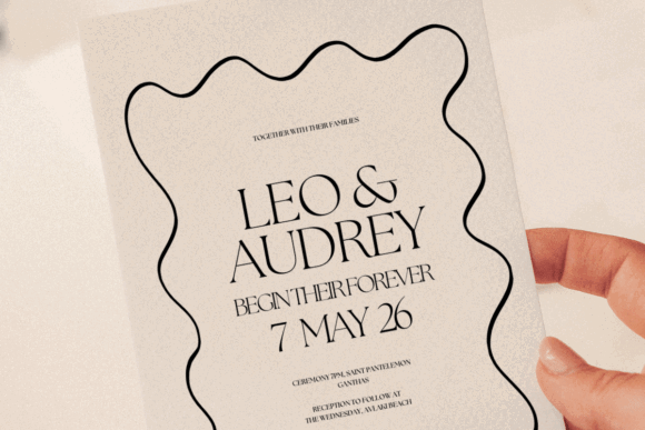 15 Wedding Invitation Template Ideas for Every Style 24 Black wavy wedding invitation featuring names and date.