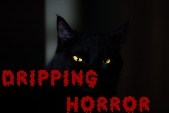 36 Best Halloween Fonts for Invitations, Shirts, Signs, and Crafts 41 Black cat with glowing yellow eyes and dripping horror text overlay.