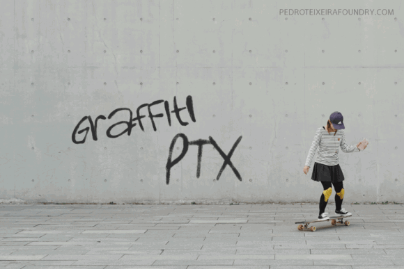 20 Best Graffiti Fonts for T-Shirt Design That Print Well 17 Skateboarder in a striped shirt skating near graffiti that reads 'graffiti PTX'.
