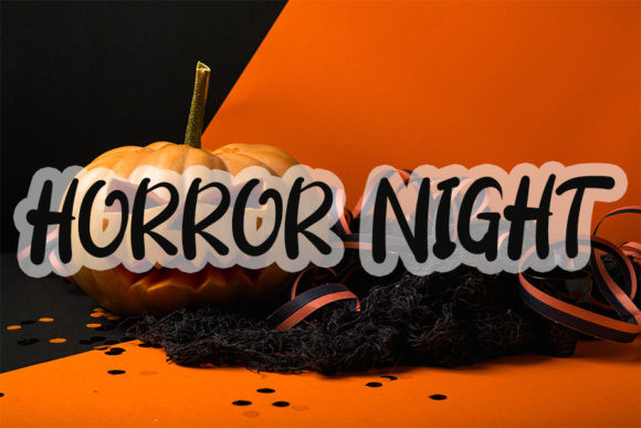 Halloween Fonts: 44 Best Picks for Cards, Signs & Cricut 31 Halloween pumpkin with the text 'HORROR NIGHT' on an orange and black background.