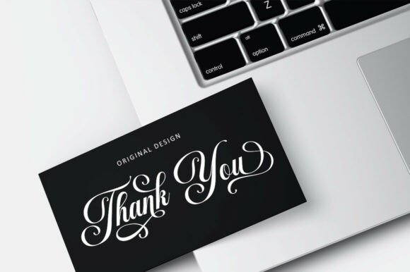 16 Handwritten Fonts for Commercial Use That Look Professional 5 Elegant thank you card design on a laptop keyboard
