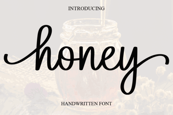 16 Handwritten Fonts for Commercial Use That Look Professional 9 The word 'Honey' in a stylish handwritten font over a jar of honey.