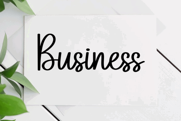 16 Handwritten Fonts for Commercial Use That Look Professional 10 Handwritten word 'Business' on a card with greenery in the background.