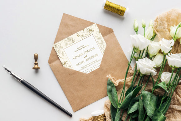 12 Wedding Invitation Template Ideas for Modern Couples 12 Elegant wedding invitation with floral design, envelope, and white flowers on a light background.