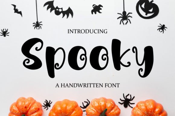 Halloween Fonts: 44 Best Picks for Cards, Signs & Cricut 18 Handwritten font 'Spooky' displayed with Halloween decorations and pumpkins.
