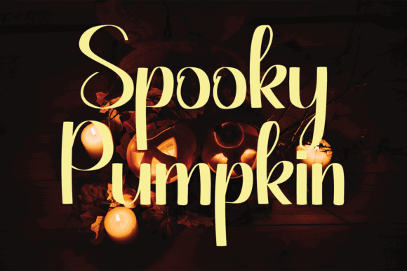 Halloween Fonts: 44 Best Picks for Cards, Signs & Cricut 40 Spooky Pumpkin font displayed with candles and pumpkins in a dark setting.