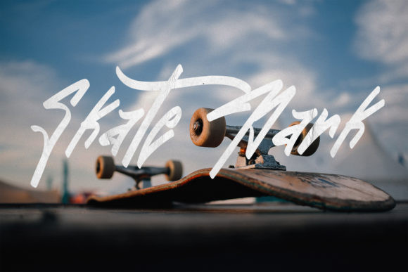 Graffiti Fonts for Logos: 10 Bold, Readable Picks 7 Stylized graffiti font spelling 'Skate Mark' over a skateboard.