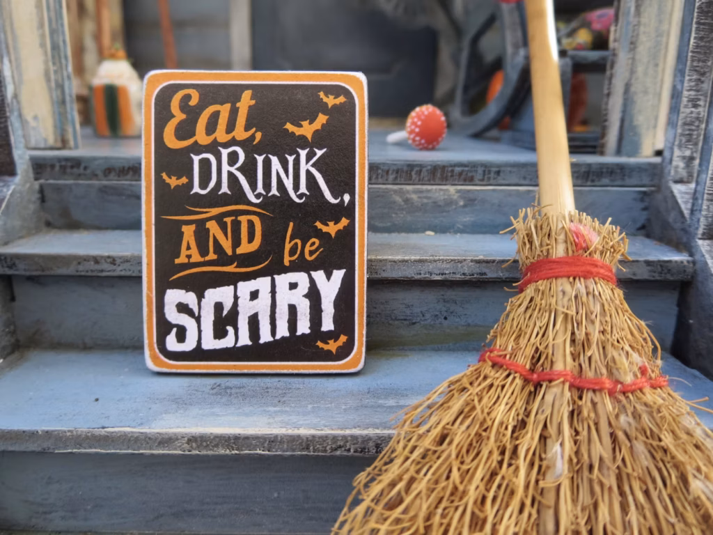 17 Halloween Fonts for Haunted House Signs That Stand Out 2 Halloween sign reading Eat, DRINK, AND be SCARY using a mix of script, serif, and distressed block fonts