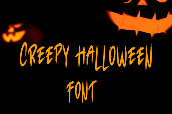44 Spooky Halloween Alphabet Fonts for Posters and Crafts 73 Creepy Halloween font displayed with glowing pumpkin faces in the background.