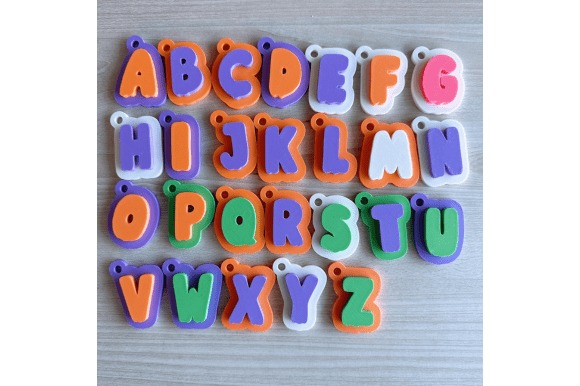 Colorful 3D Printed Keychains — DIY 3D printed gifts Colorful 3D printed keychains featuring letters A to Z in various colors. — DIY 3D printed gifts
