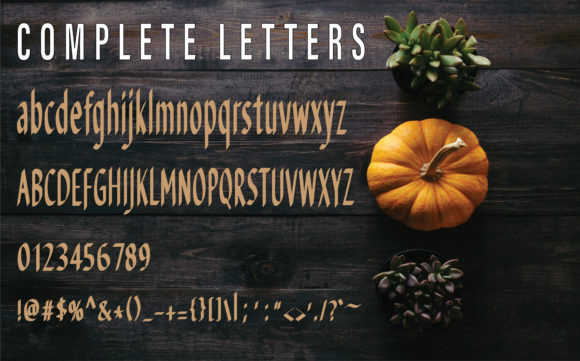 49 Thick Halloween Fonts for Bold Posters and T-Shirts 40 Thick Halloween font showcasing complete letters and a pumpkin on a wooden surface.