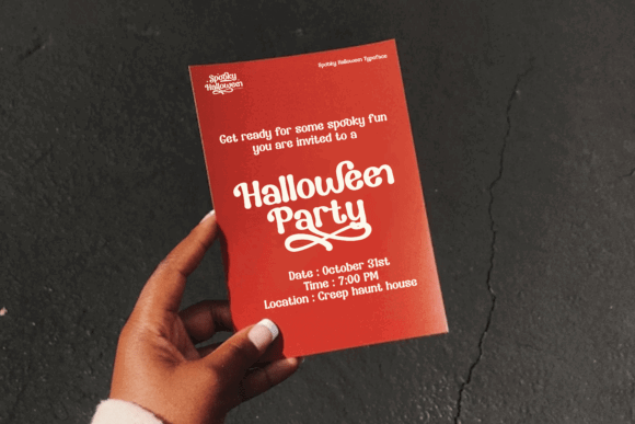 49 Thick Halloween Fonts for Bold Posters and T-Shirts 57 Hand holding a red Halloween party invitation with decorative text.