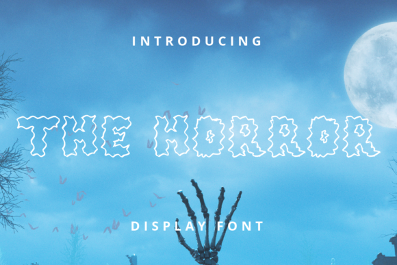 49 Thick Halloween Fonts for Bold Posters and T-Shirts 13 The Horror display font with a spooky design against a night sky background.