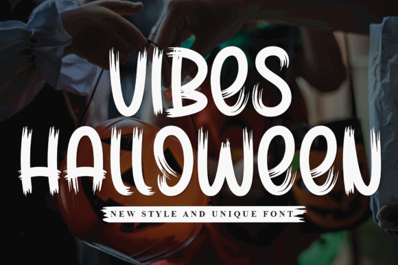 49 Thick Halloween Fonts for Bold Posters and T-Shirts 65 Vibes Halloween font displayed on a Halloween-themed background.