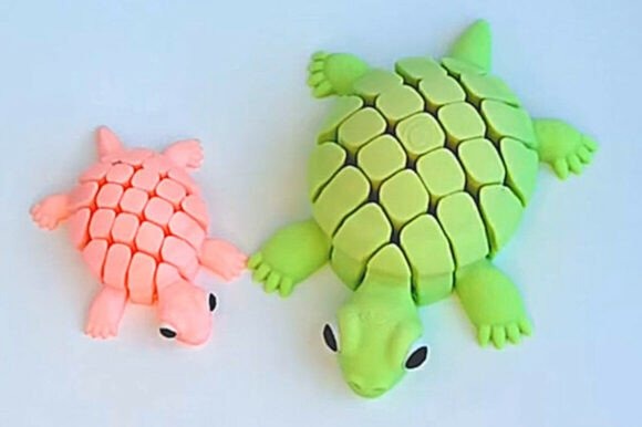 17 3D Printed Products to Sell at Craft Fairs for Profit 4 3D printed articulated turtle toys in pink and green colors โ 3D printed products