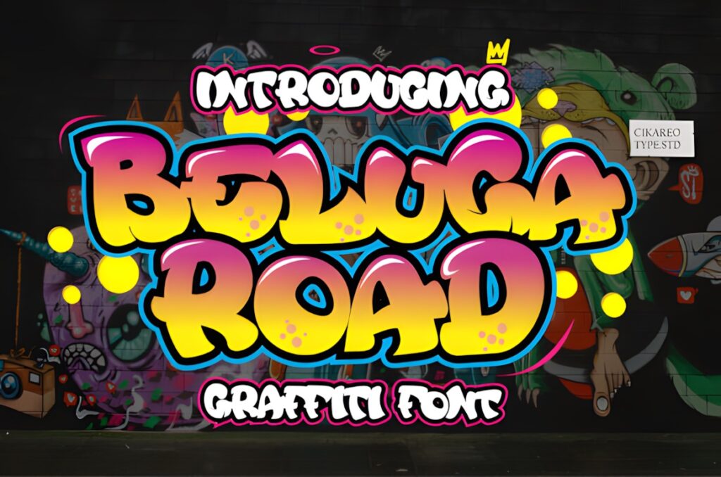 35 Graffiti Lettering: Font Picks for Street Art Designs 12 Graffiti Lettering style text reading Beluga Road in bright yellow with blue and pink outlines on a dark urban wall