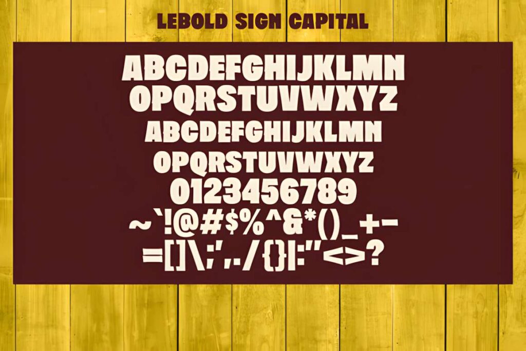 29 Canva Fonts for Painted Banners That Stand Out 86 Lebold Sign font alphabet and characters displayed on a wooden background showcasing Canva fonts for painted banners